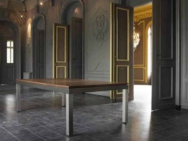 A FS5096-PT dining table in a room with gray walls.