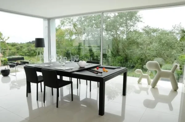 A modern dining room with a black Item # FS5097-PT table and chairs.