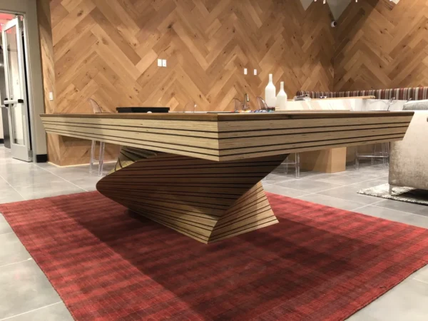 A wooden Item # CM5024-PT table in a room.