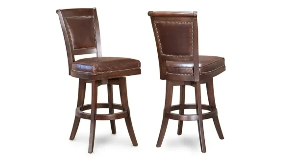 Two brown leather bar stools on a white background.