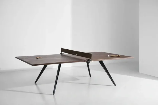 A ping pong table in a white room.