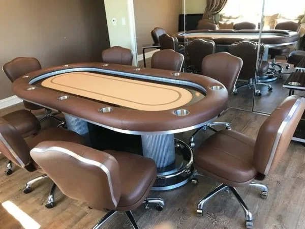A poker table and chairs in a room.