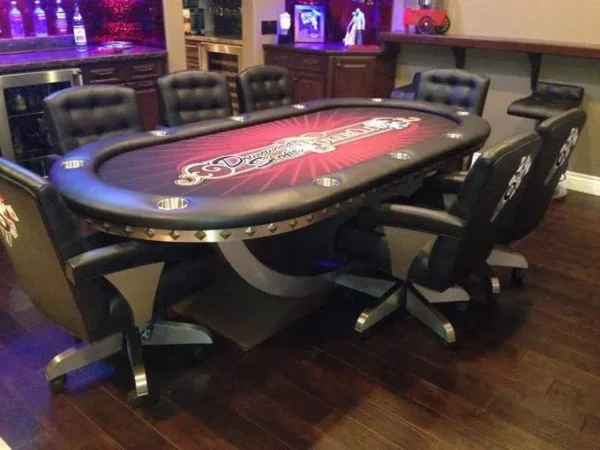 A poker table and chairs in a room.