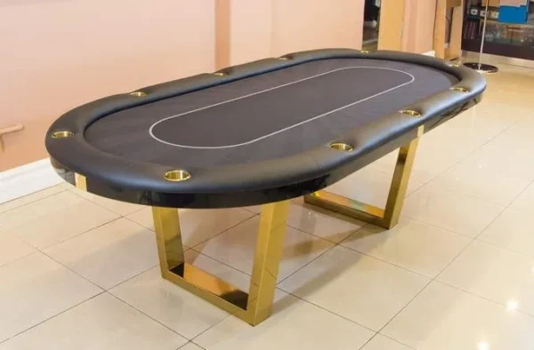 an oval shaped game table with black surface