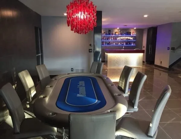 A poker table in a living room.