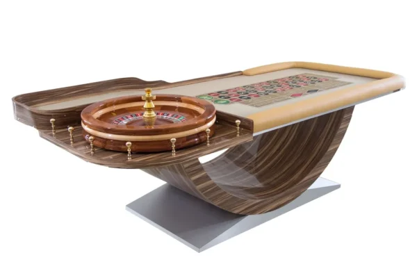 A casino table with a roule wheel on top.