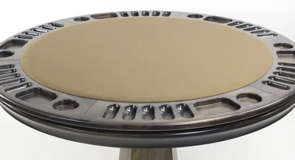 A round metal table with a tan seat.