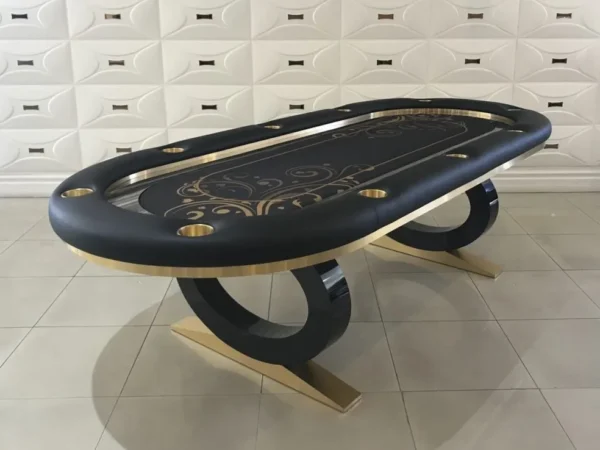 A black and gold poker table with gold trim.