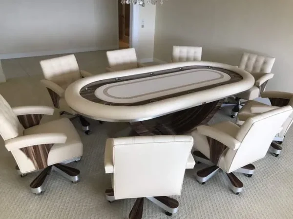A room with a poker table and chairs.