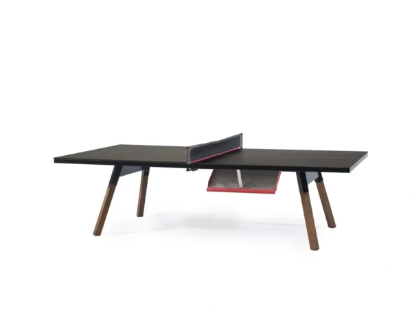 A ping pong table with a black top and red legs.