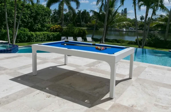 A pool table in front of a pool.
