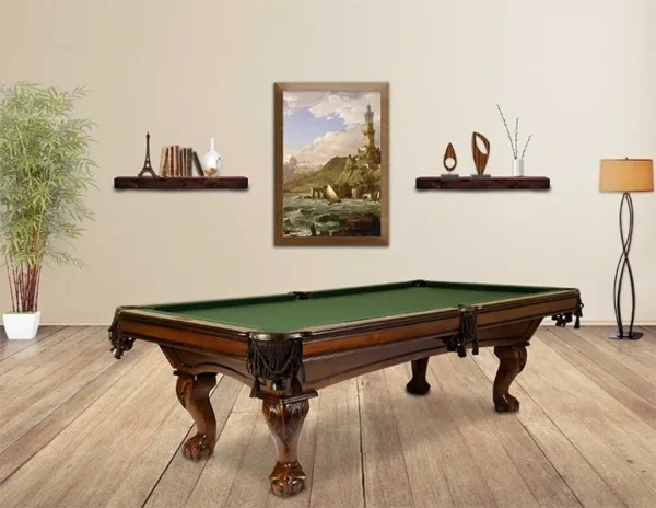 A pool table in a room with a green cloth.