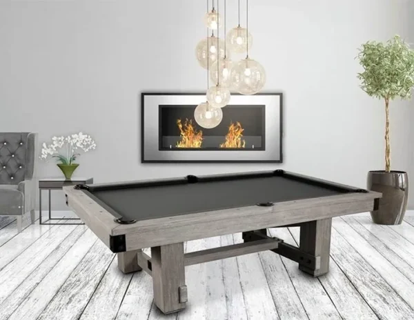 A pool table in a living room with a fireplace.
