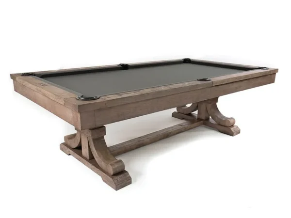A pool table with a black cloth and wooden legs.