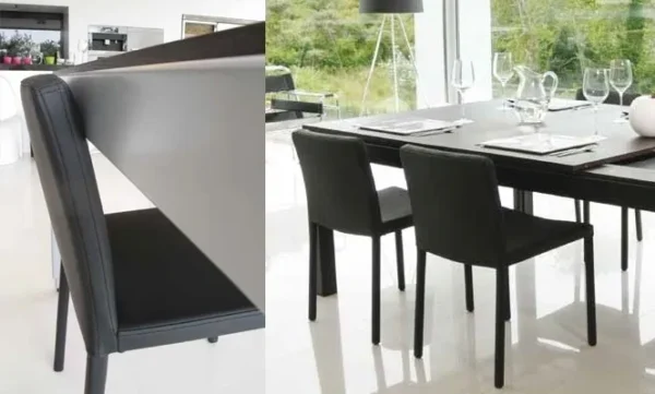 A dining room with black chairs and a white Item # FS13031-CH.