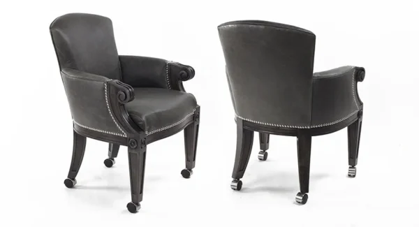 a pair of black color leather chairs on display