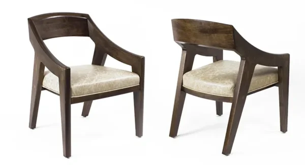 A pair of Item # CH13016-CH wooden chairs with a tan upholstered seat.