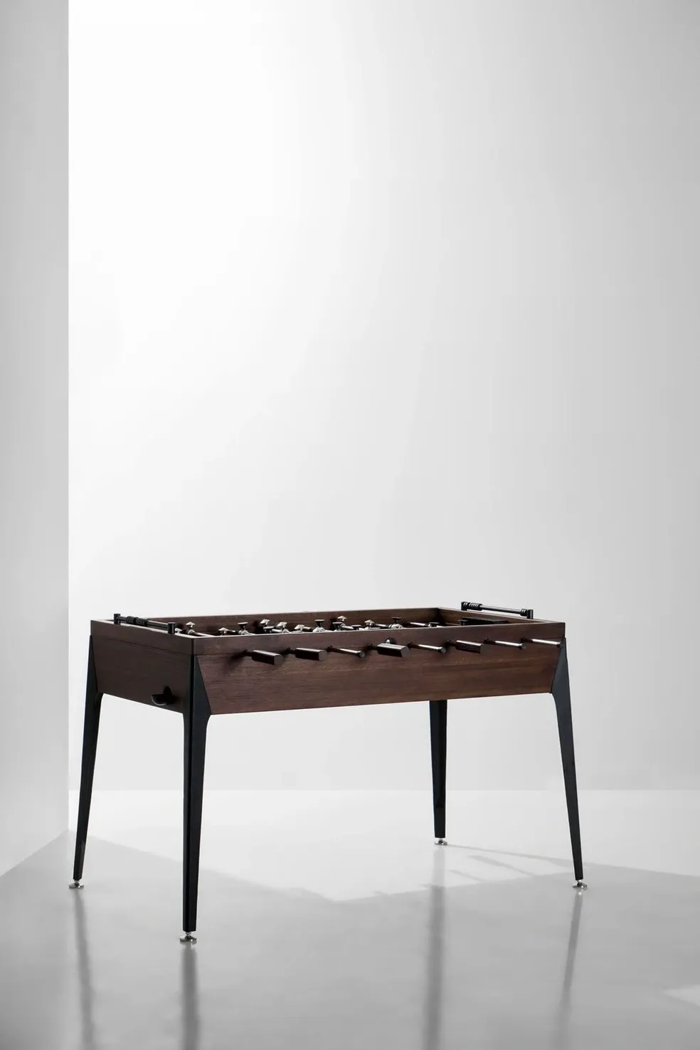 A coffee table in a room with black legs, Item # MO17001-FB.