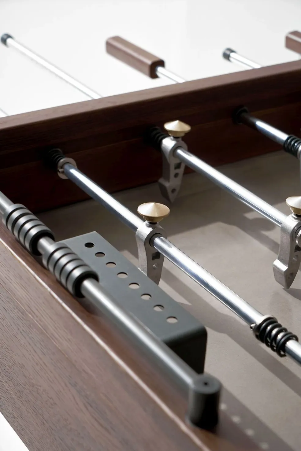 A Item # MO17001-FB foosball table with a set of metal rods.