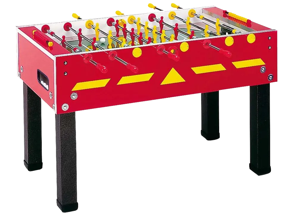 A foosball table with yellow and red balls.