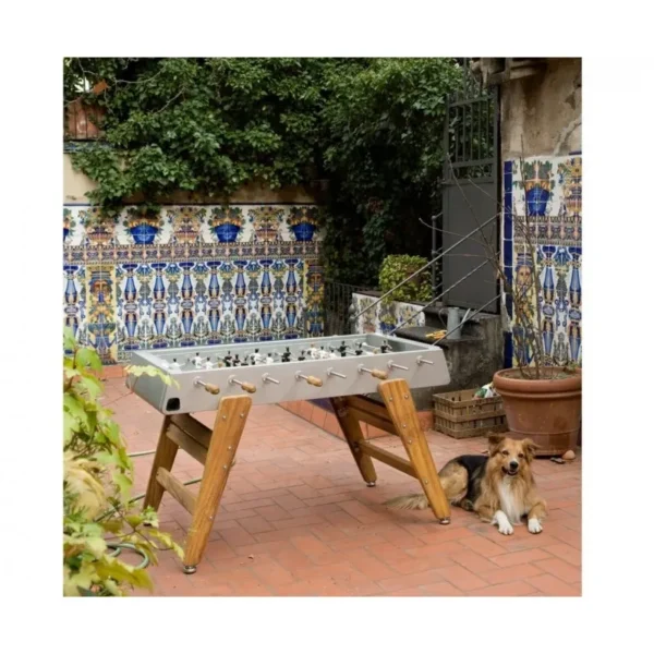 A dog sits next to the Item # MO17001-FB in a courtyard.