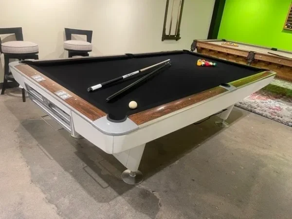 A pool table (Item # BR19059-AT) in a room with a black cloth.