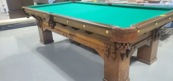 A pool table with a Item # BR19052-AT cloth on it.