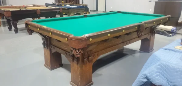 A BR19053-AT pool table in a room with a green cloth.