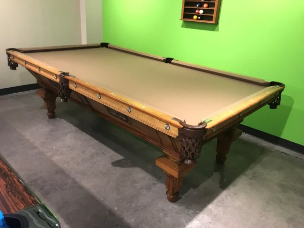 A BR19018-AT pool table in a room with green walls.