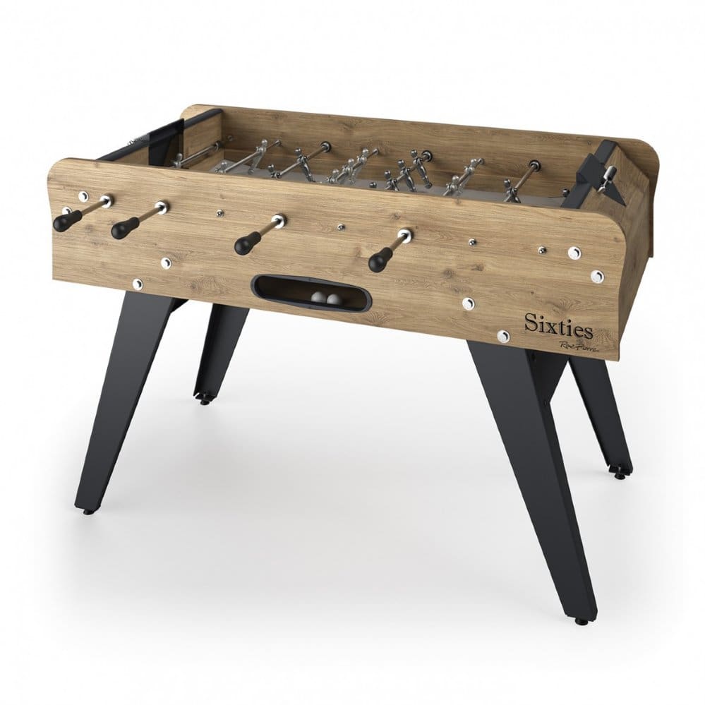 A vintage-style foosball table with Item # BB17084-FB label, featuring wooden design and sturdy black legs.