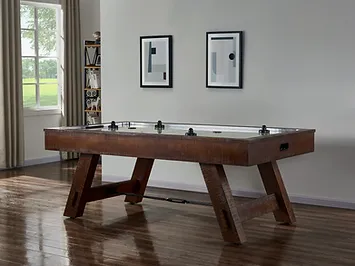 A brown wooden air hockey table.