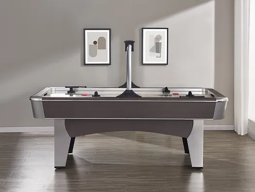 Gray air hockey table with metal legs.