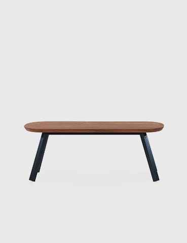 Wooden bench with black legs.