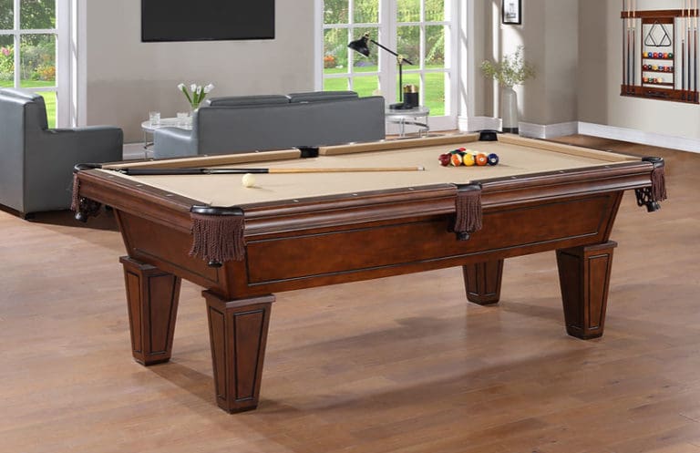 Wooden pool table with billiard balls.