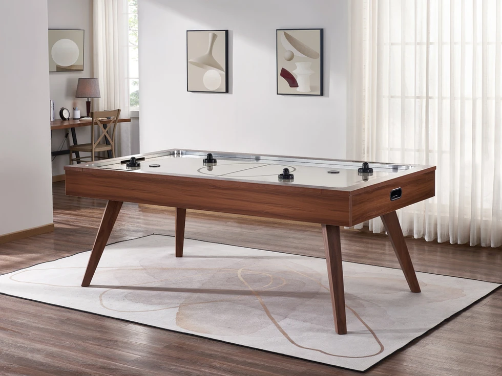 Brown wooden air hockey table with glass top.