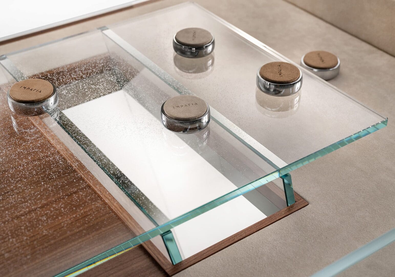 Glass top table with Impatia coasters.