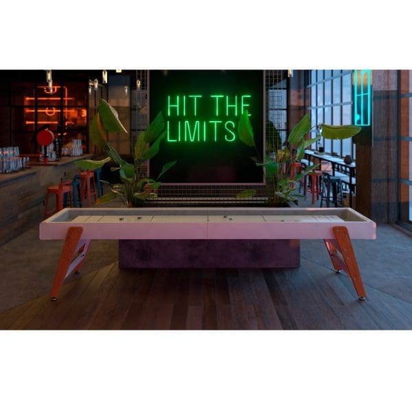 Here's an alt tag for the image: Modern shuffleboard table, "Hit the Limits" sign.