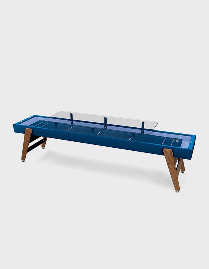 Blue shuffleboard table with glass cover.