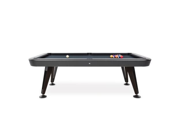 Black pool table with balls on felt.